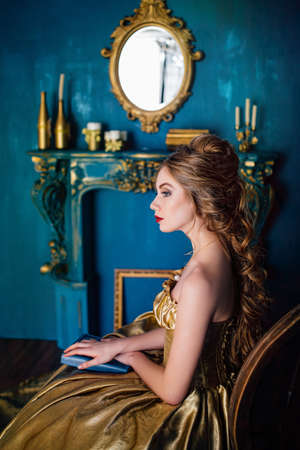 Beautiful woman in a ball gownの写真素材