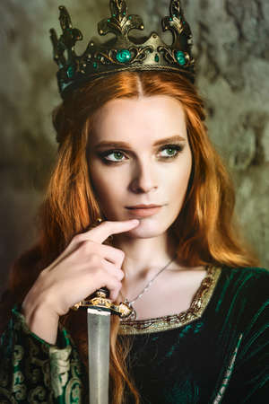 Woman in green medieval dressの写真素材