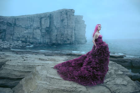 Woman near foggy seaの写真素材