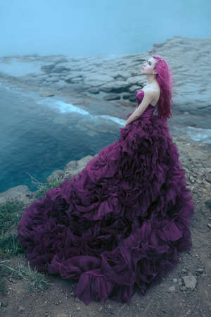 Woman near foggy seaの写真素材