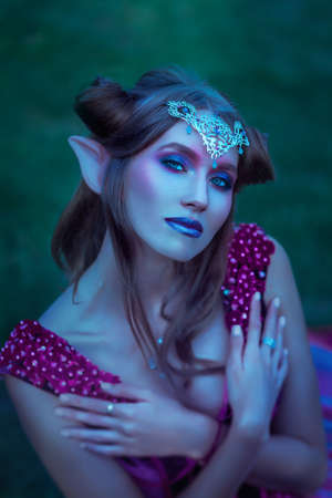 Elf woman in violet dressの写真素材