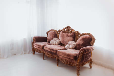 Brown sofa in white interiorの写真素材