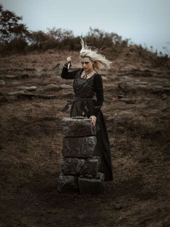 Witch in a long black dressの写真素材