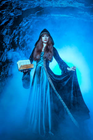 The witch with magic ball in her hands causes a spiritsの写真素材