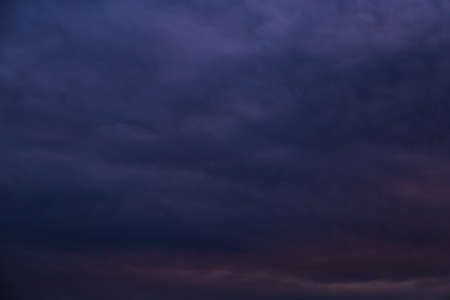 Dark stormy sky. Gloomy clouds. Overcast weather