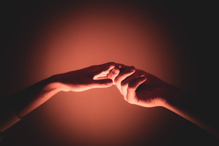 Close-up of a man and a woman hands gently touching, symbolizing connection, unity, and human relationships.の写真素材