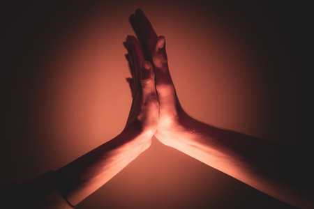 Close-up of a man and a woman hands gently touching, symbolizing connection, unity, and human relationships.の写真素材