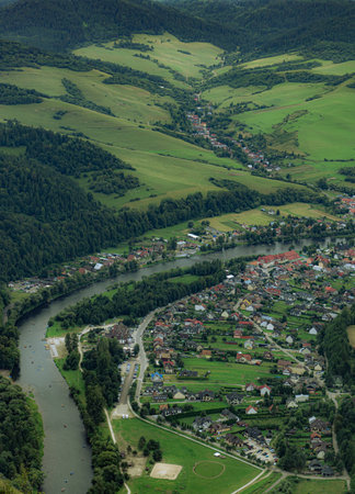 View from Trzy Korony on Dunajec River in Pieniny, Poland, showing cliffs, river, and lush green landscape.の写真素材