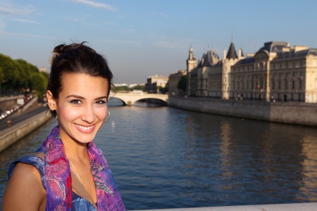 Beautiful young woman enjoying the sights of Paris along the River Seine の写真素材