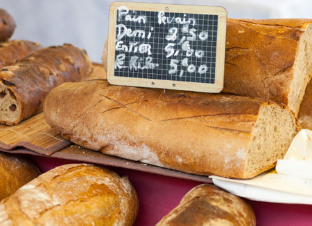 Freshly baked gourmet bread on sale from a outdoor market in Paris, France のeditorial素材