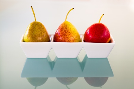 Fresh forelle pears served on a white dish の写真素材