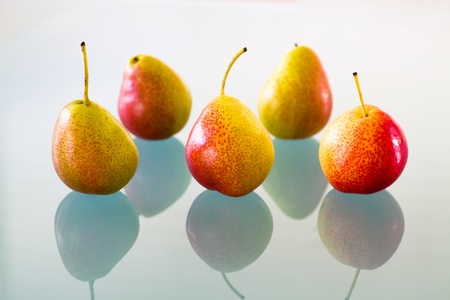 Fresh forelle pears isolated on a reflecting surface の写真素材