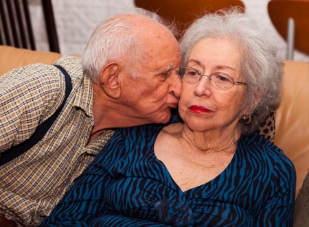 Elderly couple in their 80s being affectionate の写真素材