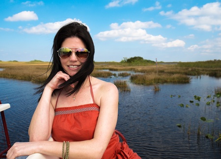 Beautiful woman enjoying the outdoors in the Florida Everglades の写真素材