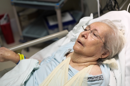 Elderly 80 plus year old woman in a hospital bed の写真素材