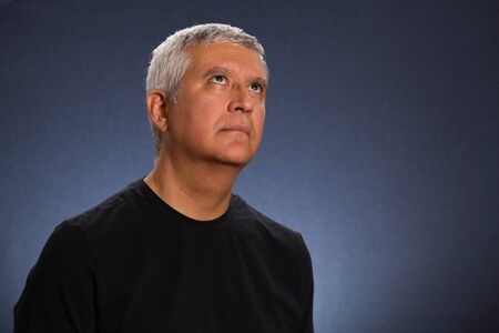 Handsome middle age man in a studio portrait.の写真素材