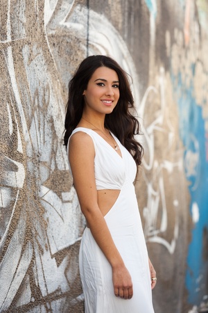 Beautiful young multicultural woman outdoors in a fashion pose.の写真素材