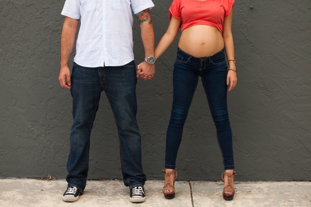 Young pregnant couple in a loving pose の写真素材