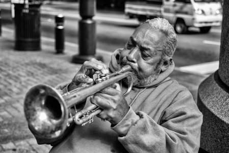 CHARLOTTE, NORTH CAROLINA OCTOBER 10  An unidentified African American street performer playing blues style music on the trumpet in uptown Charlotte on October 10, 2013 のeditorial素材
