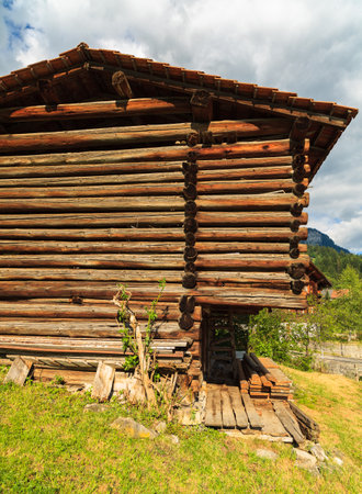 Rustic log cabin in a Swiss mountain valley.のeditorial素材