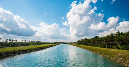Long straight canal along a rural country road の写真素材