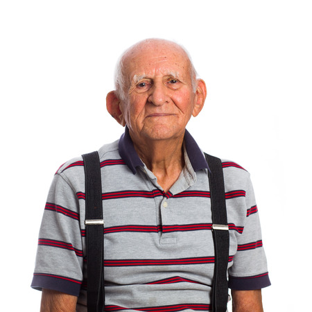 Elderly eighty plus year old man in a studio portrait on a white background.の写真素材