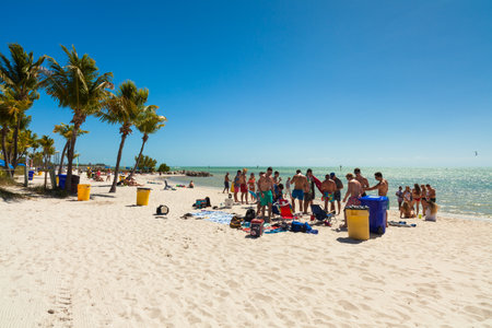 Key West, Florida USA - March 3, 2015: Young college students enjoying spring break on a Key West beach in Florida.のeditorial素材