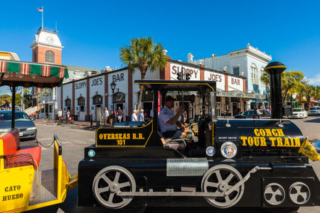 Key West, Florida USA - March 3, 2015: The historic Sloppy Joe's Bar on Duval Street in downtown Key West with the Conch Train.のeditorial素材