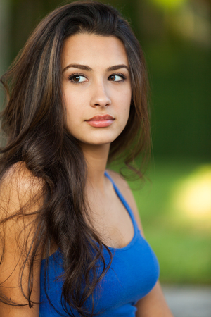 Beautiful multicultural young woman outdoor portrait.の写真素材