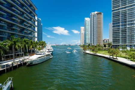 Downtown Miami along the Miami River inlet with Brickell Key in the background and yachts at the dock.のeditorial素材