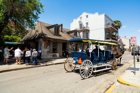 New Orleans, LA USA - April 22, 2016: Carriage ride waiting for tourists on Bourbon Street in the French Quarter district.のeditorial素材