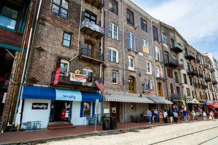 Savannah, GA USA - April 25, 2016: Cityscape of the Riverfront Plaza with shops along the Savannah River in the historic downtown area.のeditorial素材