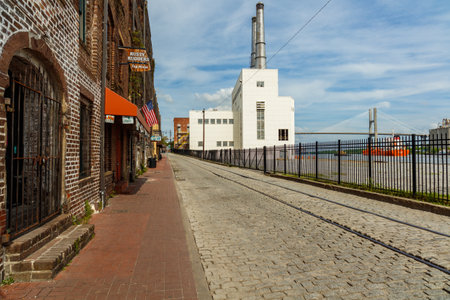 Savannah, GA USA - April 25, 2016: Cityscape of the Riverfront Plaza with shops along the Savannah River in the historic downtown area.のeditorial素材