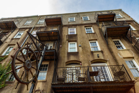 Savannah, Georgia cityscape along the Riverfront Plaza with vintage apartments.のeditorial素材
