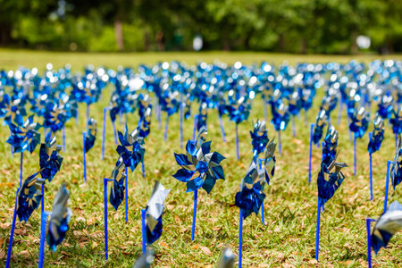Pinwheels commemorating Child Abuse Prevention Month at the popular Audubon Park in New Orleans, Louisiana.のeditorial素材