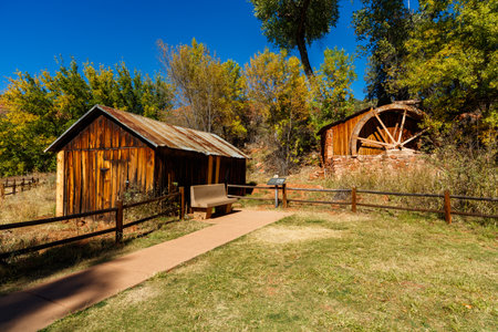 Beautiful vintage rustic barn with a water mill.のeditorial素材