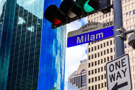 Milam street sign in downtown Houston, Texas with skyscrapers in the background.の写真素材