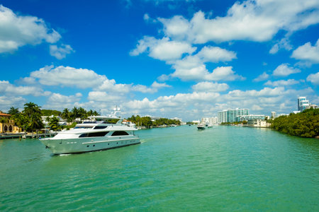 Miami Beach, FL USA - February 13, 2017: Luxury yachts cruising along the intracoastal waterway for display at the popular Miami International Boat Show.のeditorial素材