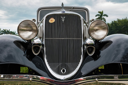 Miami, FL USA - March 12, 2017: Close up view of the front end of a beautifully restored vintage 1933 Ford 2 door sedan automobile at a public car show along Palmetto Bay in Miami.のeditorial素材