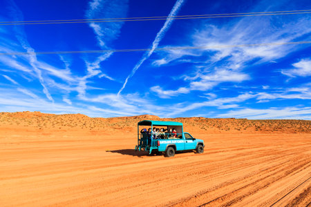 Page, AZ USA - October 26, 2016: Pick up truck filled with tourists on the way to visit the beautiful sandstone walls of Upper Antelope Canyon in Arizona.のeditorial素材