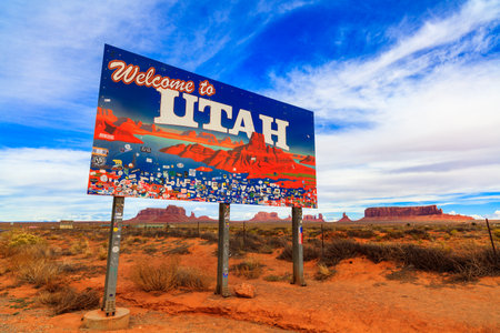 Monument Valley, Utah USA - November 1, 2016: The colorful Welcome to Utah sign with the natural beauty of the red sandstone buttes in the background.のeditorial素材