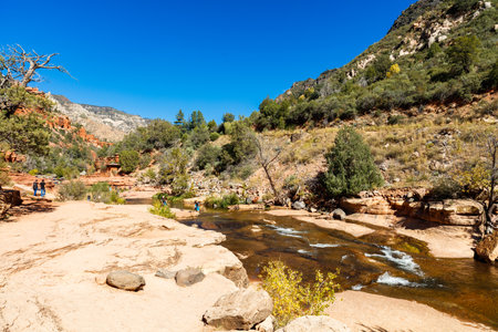 Coconino, AZ USA - October 17, 2016: Visitors enjoying the beauty of Slide Rock State Park with its natural rock water slides in the Oak Creek Canyon near Sedona.のeditorial素材