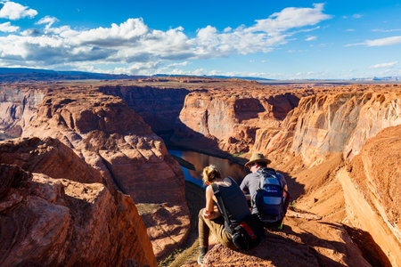 Page, AZ USA - October 25, 2016: Visitors enjoying the natural beauty of the desert landscape at the popular Horseshoe Bend travel landmark.のeditorial素材