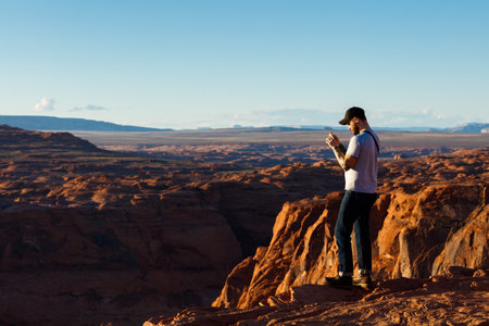 Page, Arizona USA - October 25, 2016: Visitors enjoying the natural beauty of Horseshoe Bend in the late afternoon sun.のeditorial素材