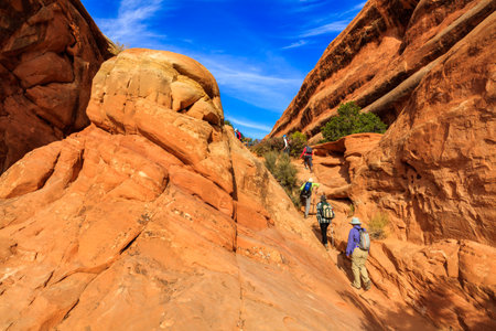 Utah, USA - November 4, 2016: Visitors enjoying the beauty of Arches National Park with over 2,000 natural sandstone arches and numerous hiking trails near Moab.のeditorial素材