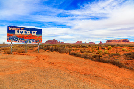 Monument Valley, Utah USA - November 1, 2016: The colorful Welcome to Utah sign with the natural beauty of the red sandstone buttes in the background.のeditorial素材