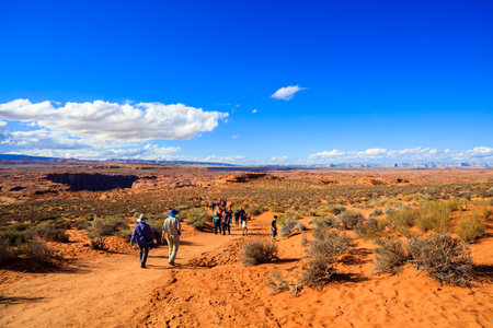 Page, AZ USA - October 25, 2016: Long trail leading to the beautiful desert landscape at the popular tourist attraction Horseshoe Bend.のeditorial素材