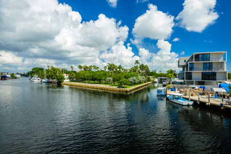 Miami, Florida - August 16, 2017: Scenic Miami River cityscape with fishing boats and public park along the Northwest Fifth Street drawbridge.のeditorial素材