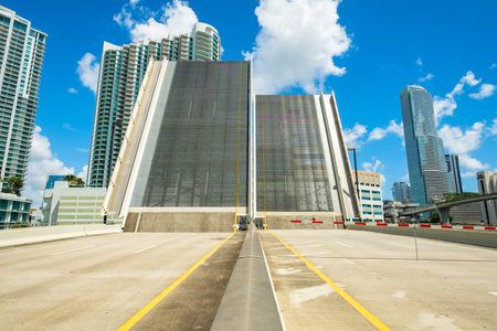 Miami, Florida - August 17, 2017:  Cityscape view of the downtown Miami riverfront skyline viewed from the South Miami Avenue drawbridge.のeditorial素材