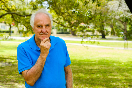 Elderly handsome man outdoor portrait.